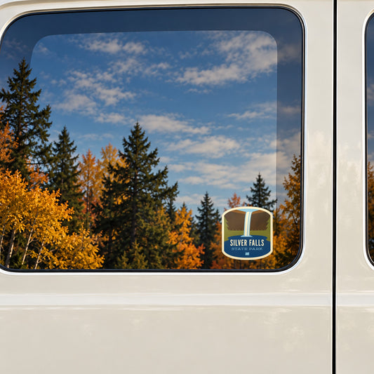 Silver Falls sticker on the rear window of a van, reflecting fall colour