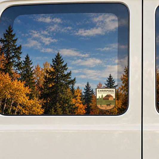 Champoeg sticker on the rear window of a van, reflecting fall colour