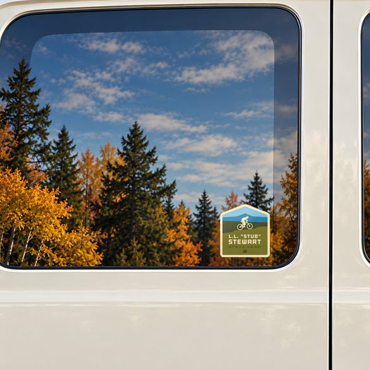Stub Stewart sticker on the rear window of a van, reflecting fall colour